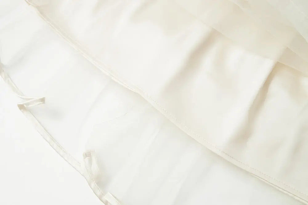 An image of a   10206 Layered Tulle Ruffle Midi Skirt by  Mirra Masa