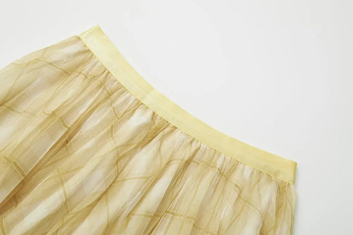 An image of a   10276 Checkered Pleated Skirt by  Mirra Masa