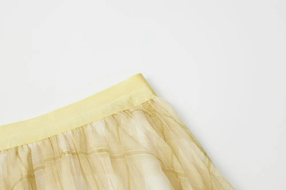 An image of a   10276 Checkered Pleated Skirt by  Mirra Masa