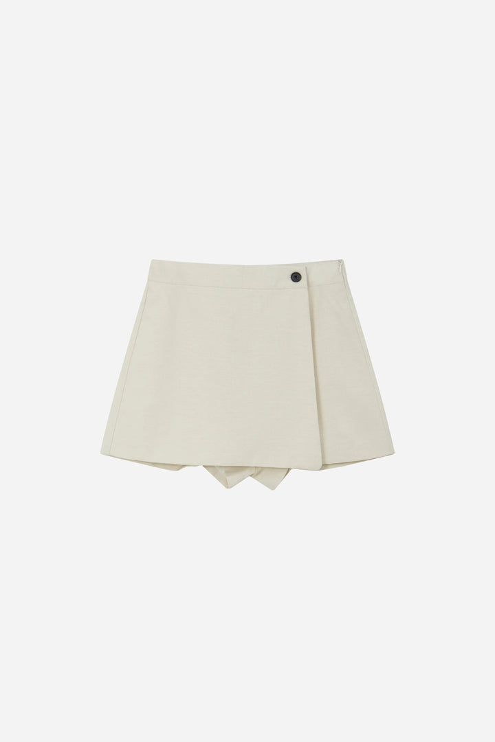 An image of a   10996 Asymmetric Button-Wrap Skirt by  Mirra Masa