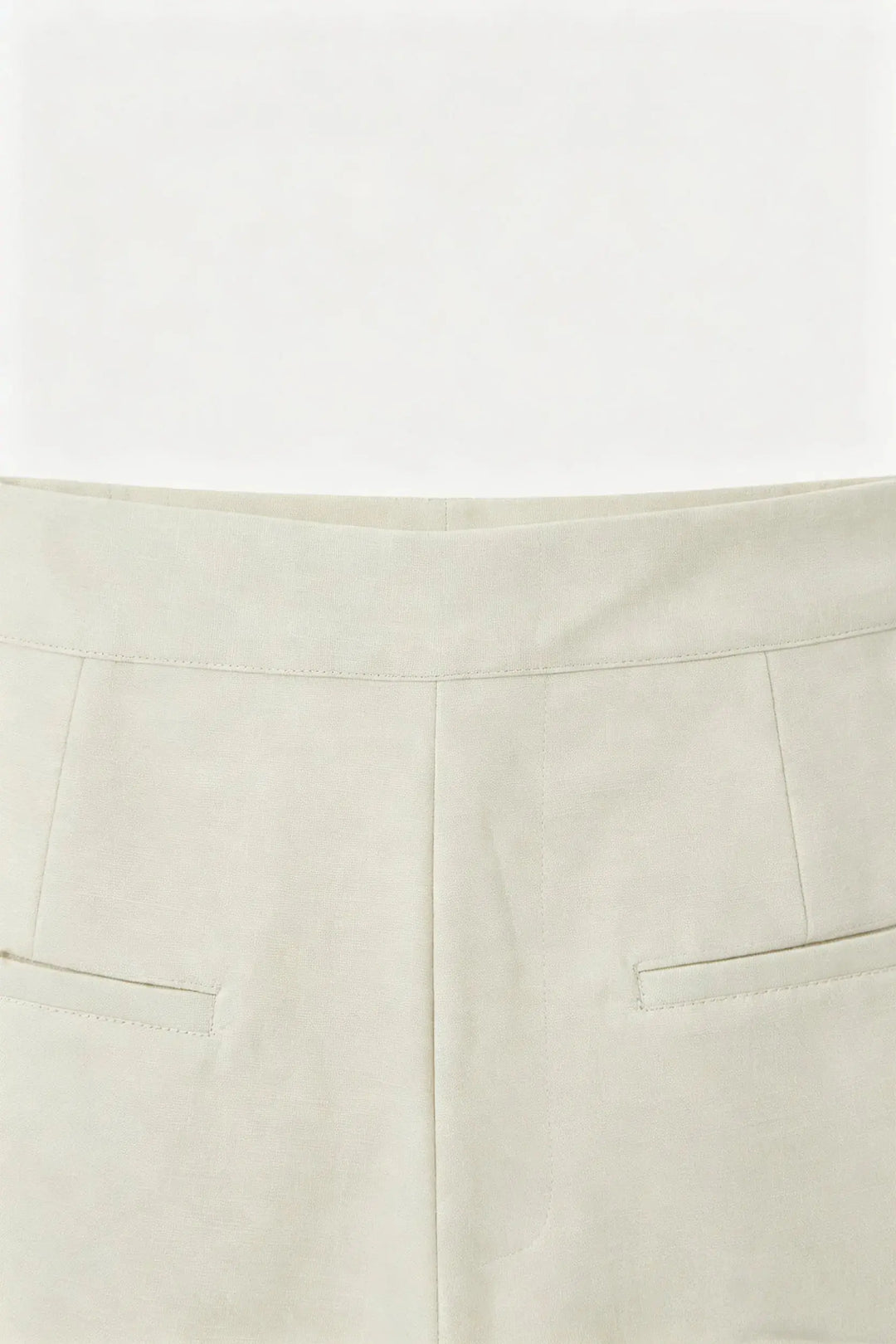 An image of a   10996 Asymmetric Button-Wrap Skirt by  Mirra Masa