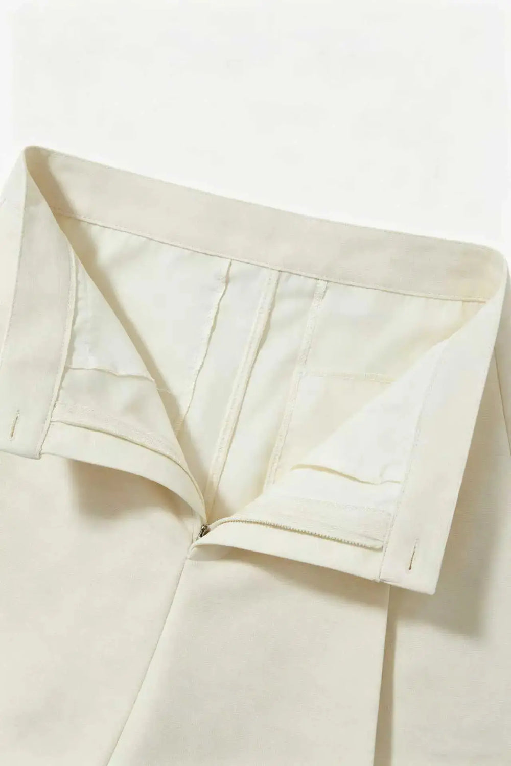 An image of a   10996 Asymmetric Button-Wrap Skirt by  Mirra Masa