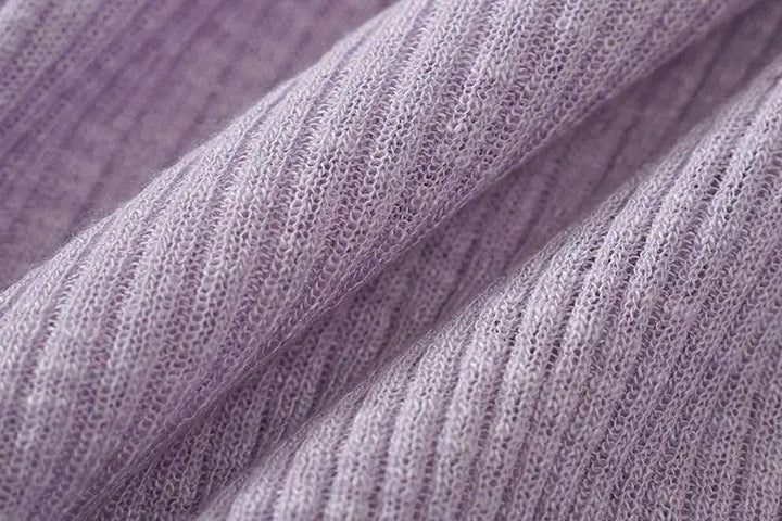 An image of a   11030 Ribbed V-Neck Cardigan by  Mirra Masa