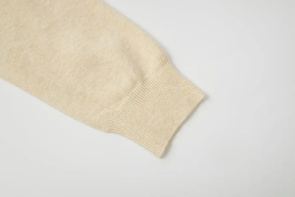 An image of a   11175 Essential Long Sleeve V-Neck Knit Top by  Mirra Masa