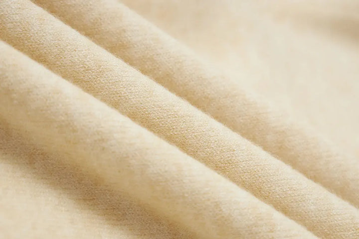 An image of a   11175 Essential Long Sleeve V-Neck Knit Top by  Mirra Masa