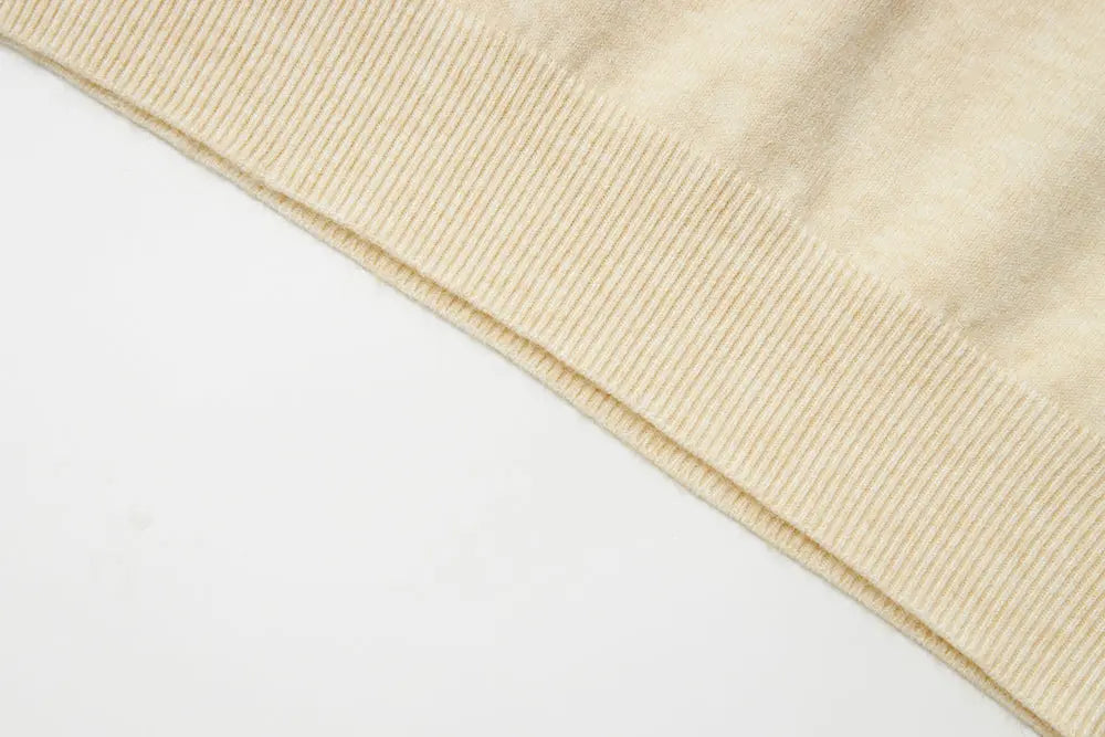 An image of a   11175 Essential Long Sleeve V-Neck Knit Top by  Mirra Masa