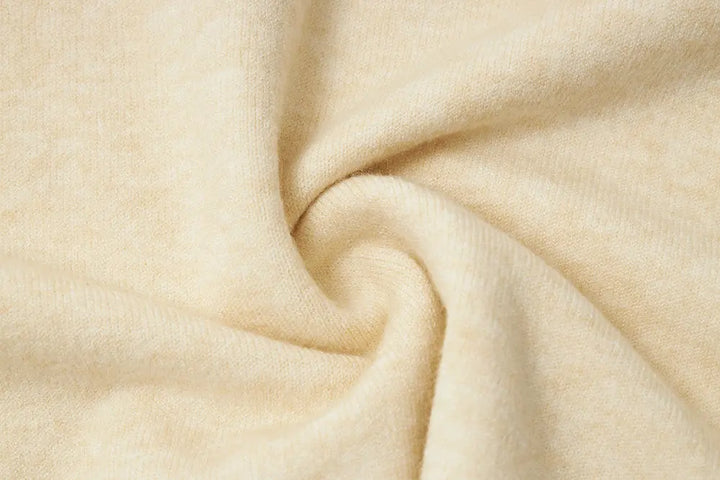 An image of a   11175 Essential Long Sleeve V-Neck Knit Top by  Mirra Masa