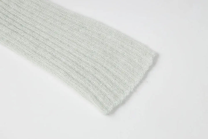 An image of a   11280 Ribbed Off-Shoulder Tie Knit by  Mirra Masa