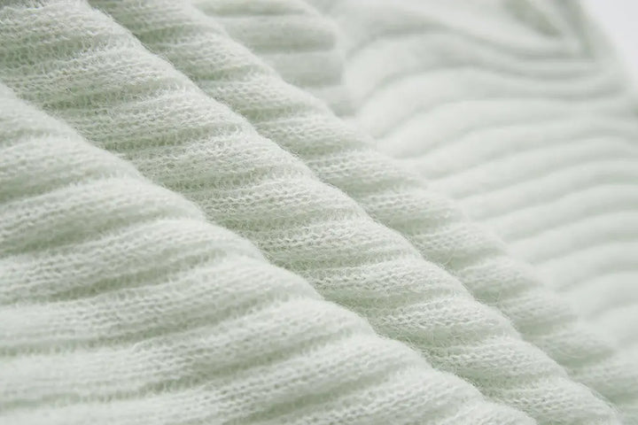 An image of a   11280 Ribbed Off-Shoulder Tie Knit by  Mirra Masa