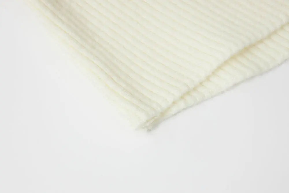 An image of a   11978 Ribbed and Fitted Layering Knit Top by  Mirra Masa