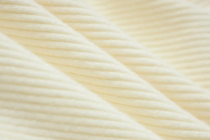 An image of a   11978 Ribbed and Fitted Layering Knit Top by  Mirra Masa