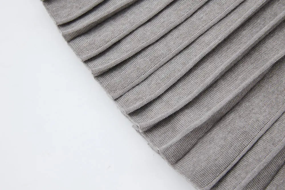 An image of a   12497 Solid Wool Blend Pleated Skirt by  Mirra Masa