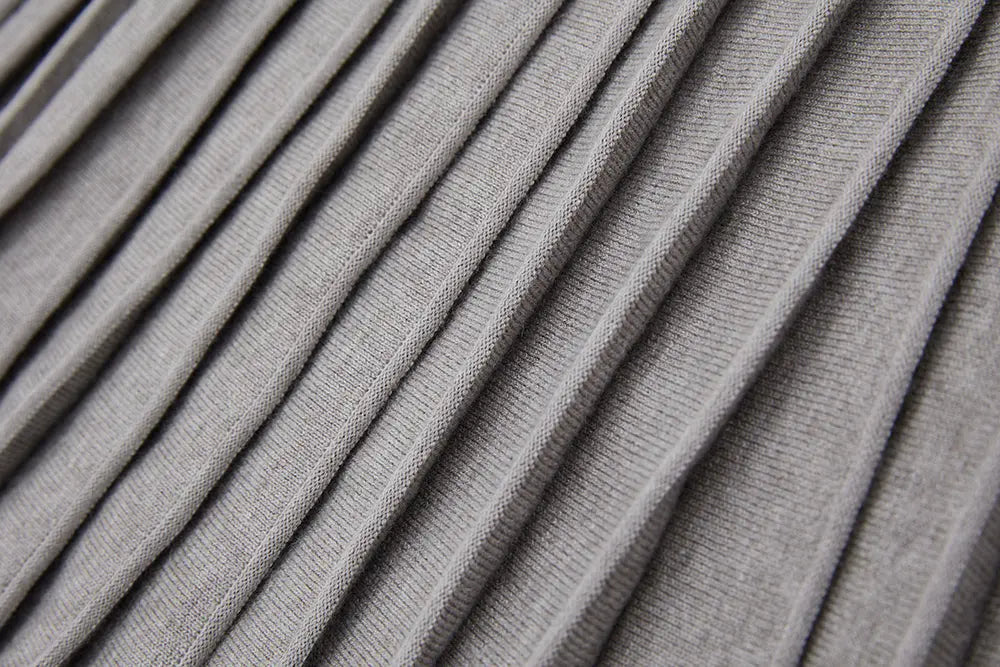 An image of a   12497 Solid Wool Blend Pleated Skirt by  Mirra Masa