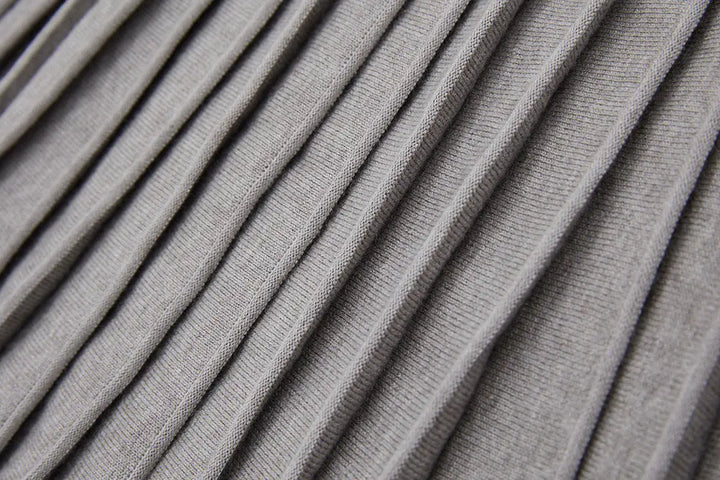 An image of a   12497 Solid Wool Blend Pleated Skirt by  Mirra Masa