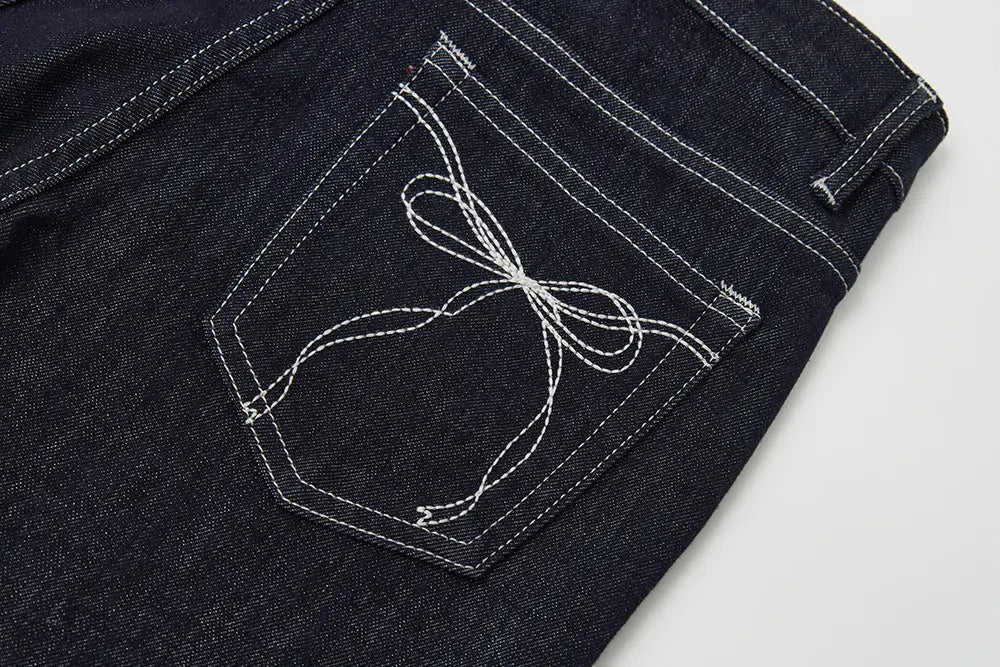 An image of a   12906 Bow Pocket Flare Jeans by  Mirra Masa