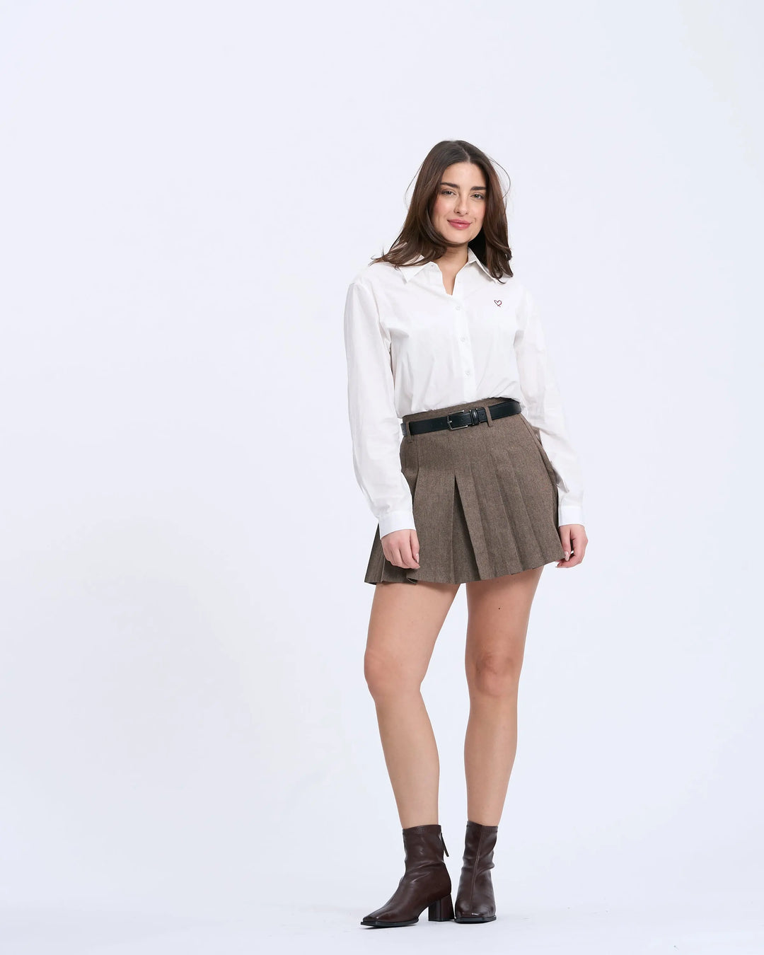 An image of a   1984Q Pleated Mini Skirt by  Mirra Masa