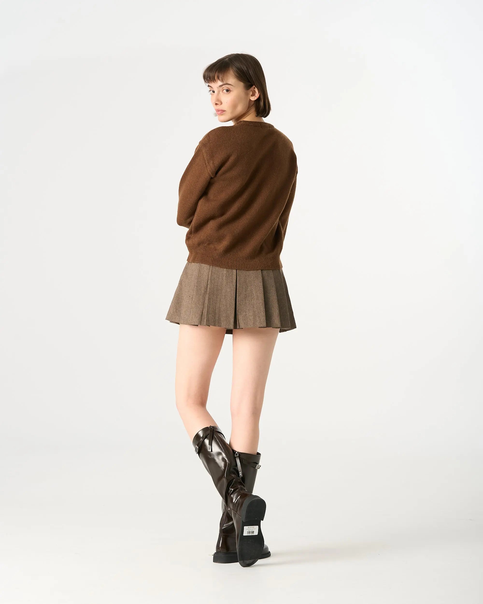 An image of a 1984Q Pleated Mini Skirt by Mirra Masa