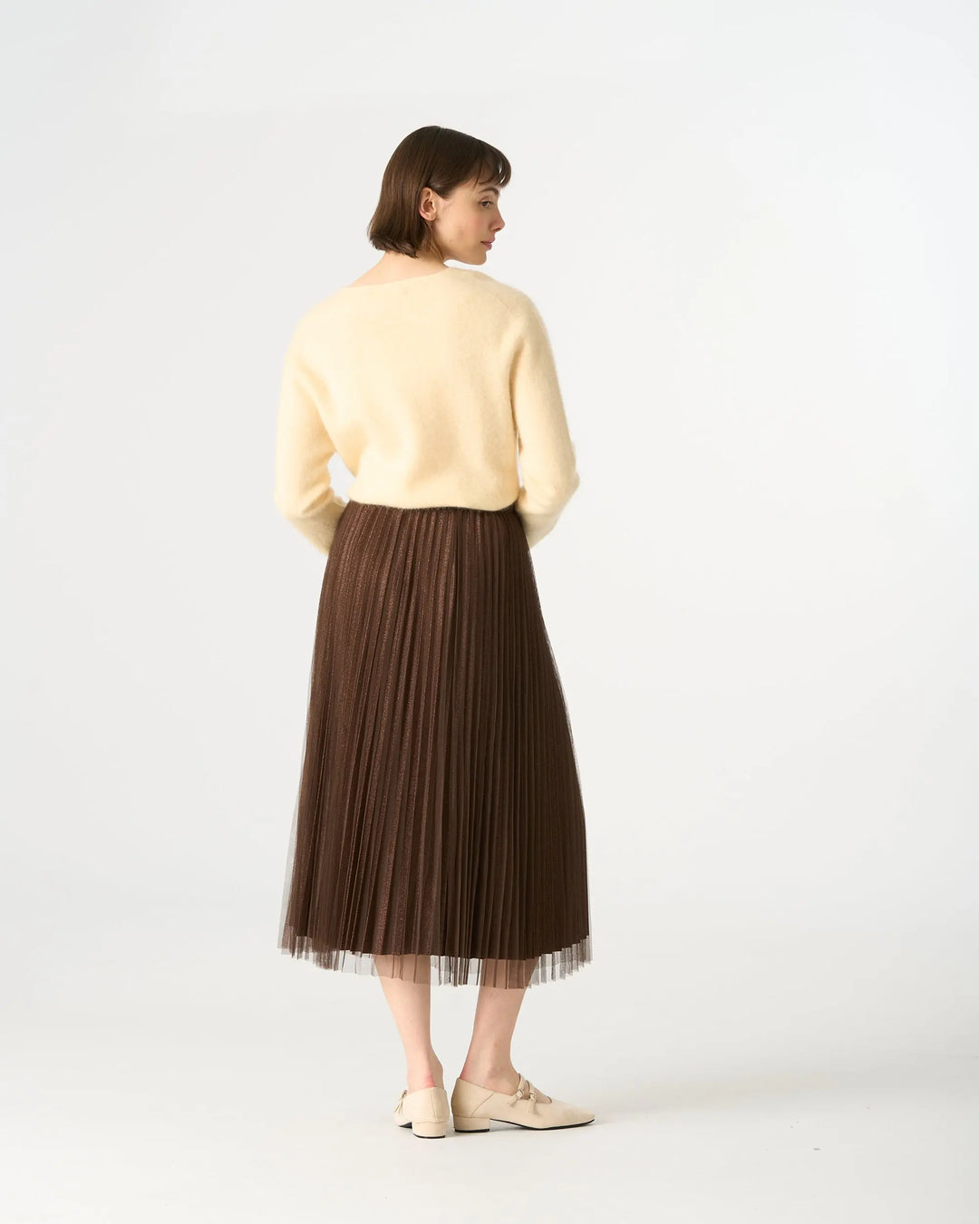 An image of a   205519 Inner-Glitter Pleated Skirt by  Mirra Masa