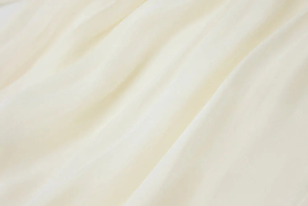 An image of a   21021 Asymmetrical Plisse Tie Blouse by  Mirra Masa