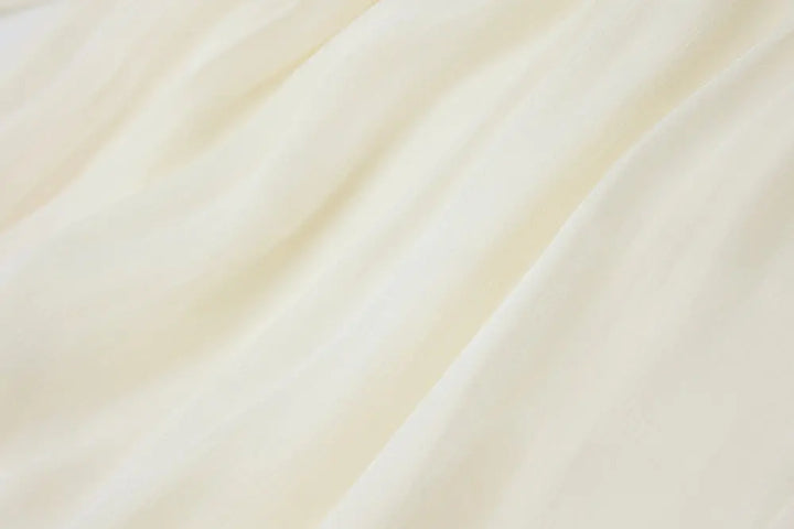 An image of a   21021 Asymmetrical Plisse Tie Blouse by  Mirra Masa