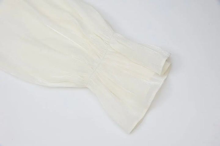 An image of a   21021 Asymmetrical Plisse Tie Blouse by  Mirra Masa