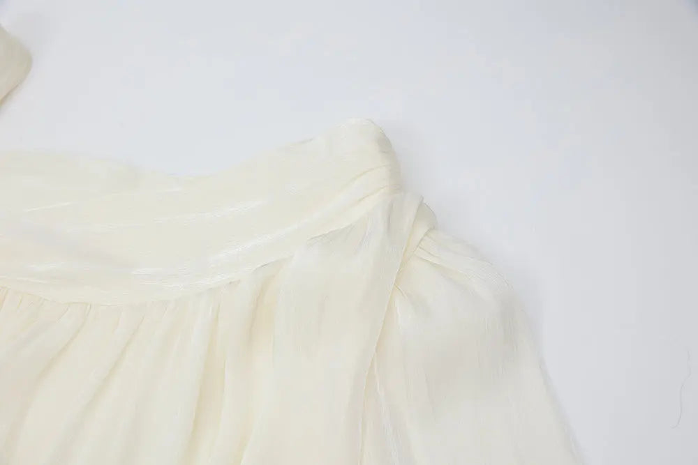 An image of a   21021 Asymmetrical Plisse Tie Blouse by  Mirra Masa