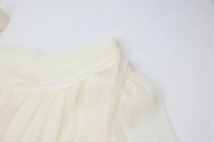 An image of a   21021 Asymmetrical Plisse Tie Blouse by  Mirra Masa