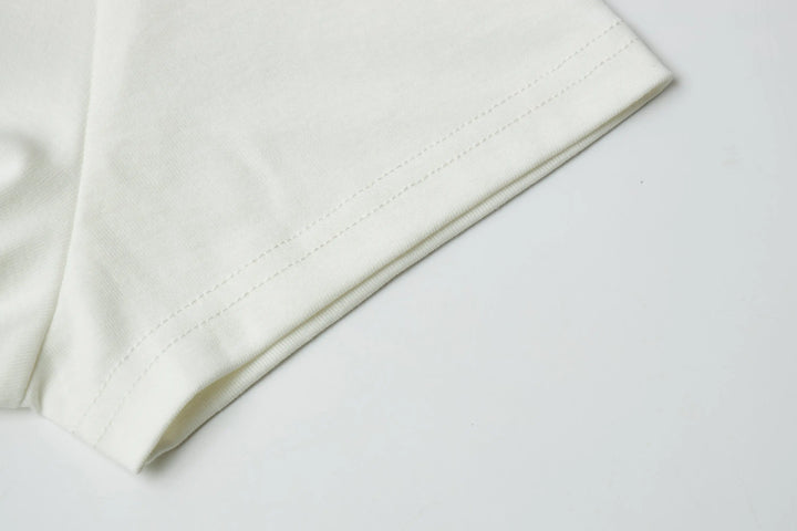 An image of a   21221 Graphic T-Shirt by  Mirra Masa