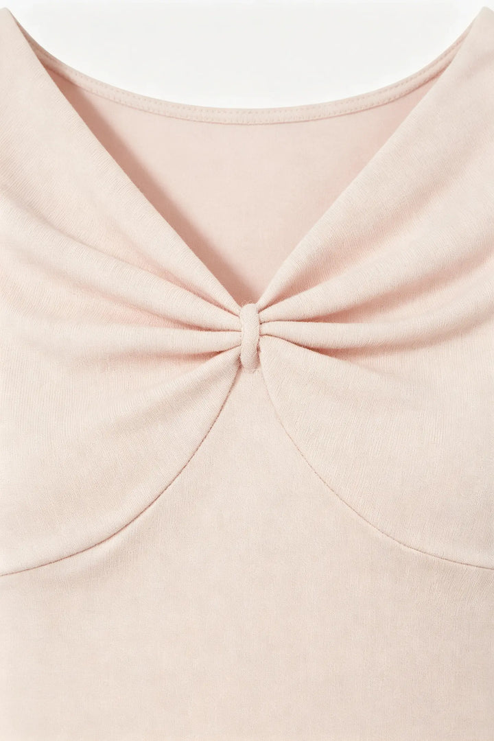 An image of a   21522 Twist Front Cap Sleeve Tee by  Mirra Masa