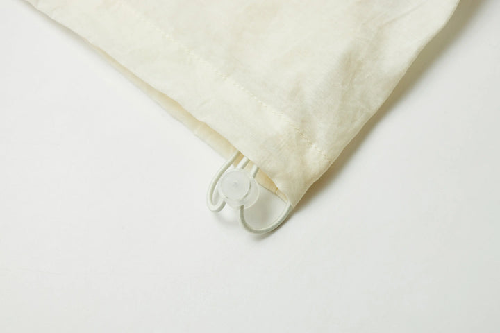 An image of a   21834 Sun Hoodie by  Mirra Masa
