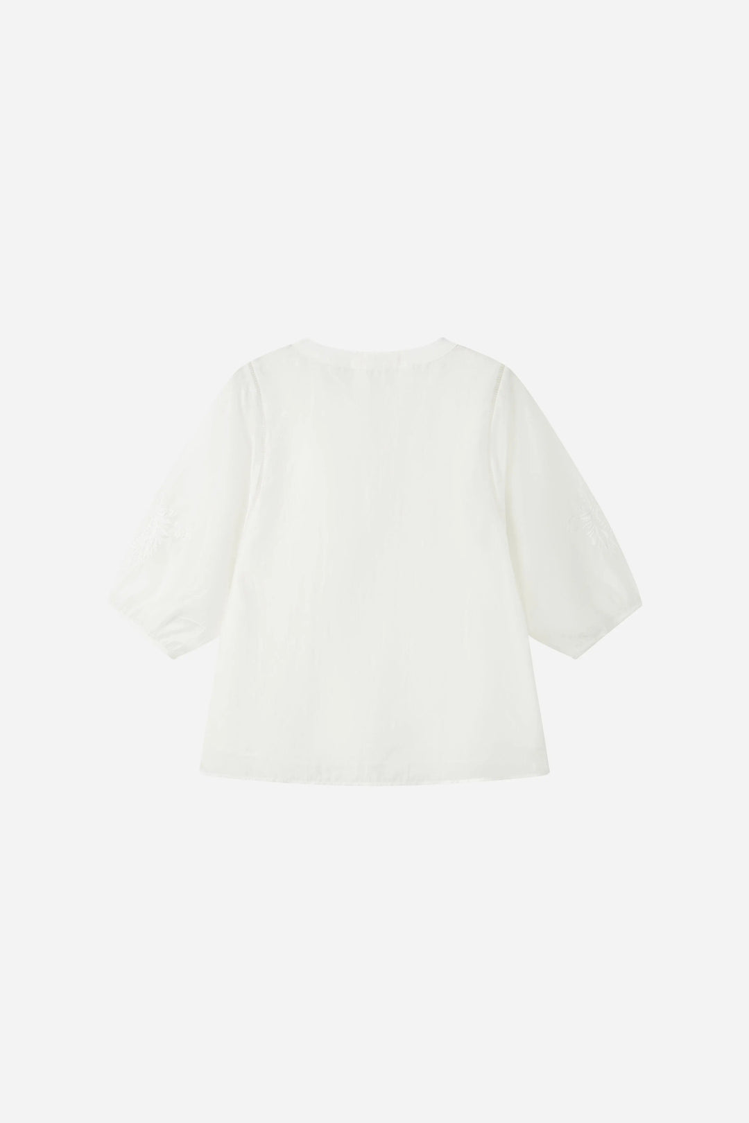 An image of a   21879 Embroidered V-Neck Blouse by  Mirra Masa