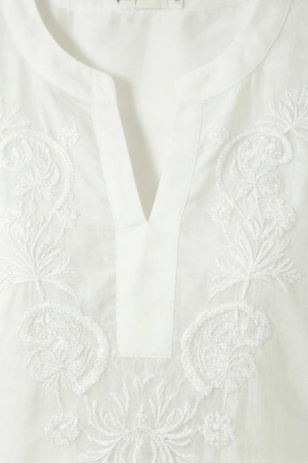 An image of a   21879 Embroidered V-Neck Blouse by  Mirra Masa