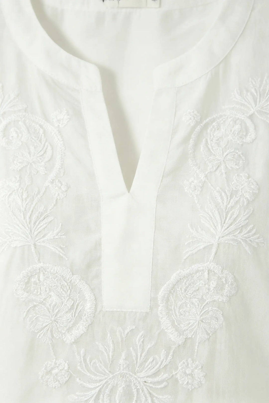 An image of a   21879 Embroidered V-Neck Blouse by  Mirra Masa