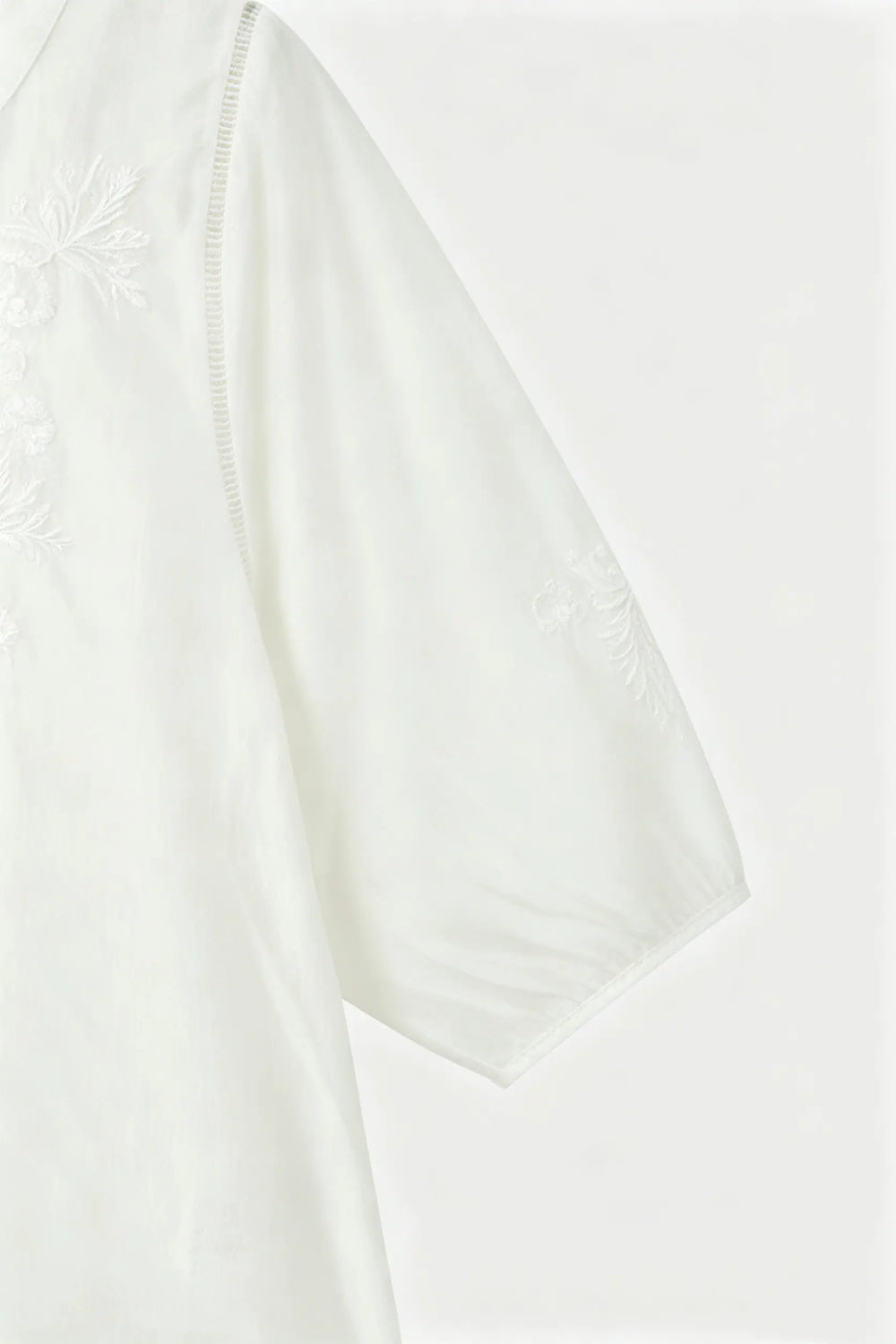An image of a   21879 Embroidered V-Neck Blouse by  Mirra Masa