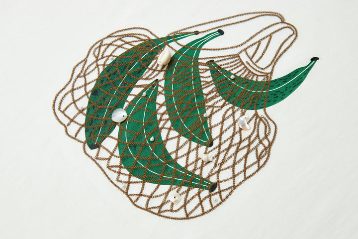 An image of a   21999 Tropical Graphic Tee by  Mirra Masa