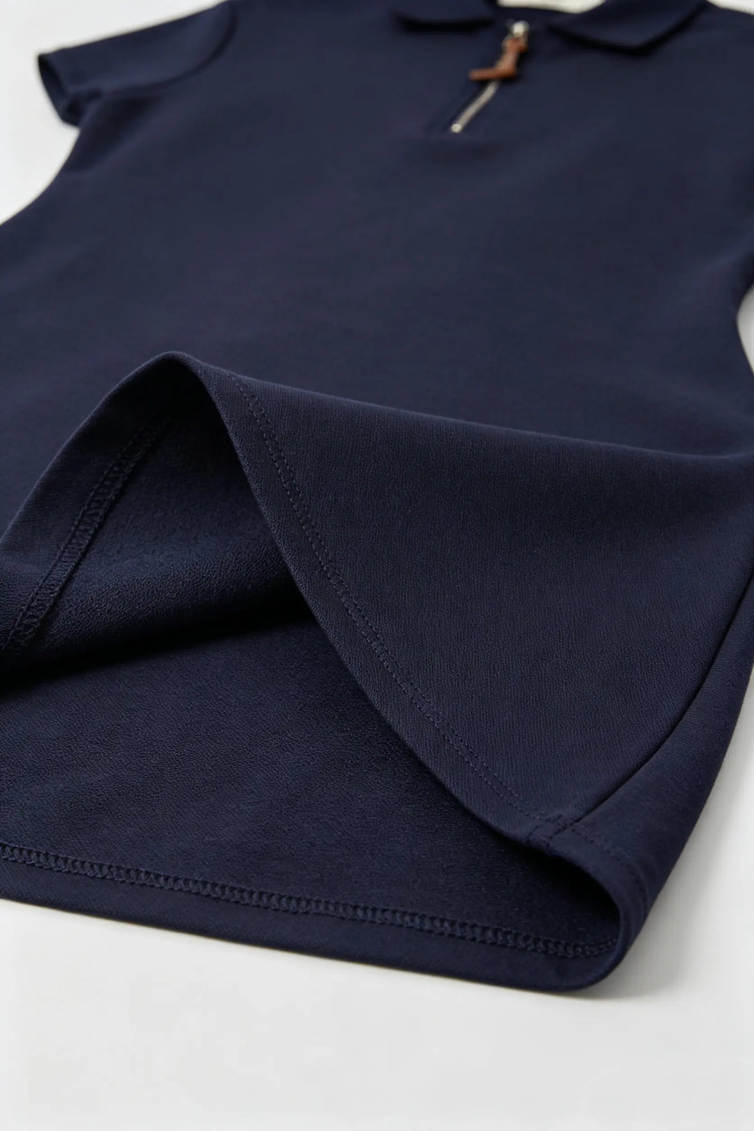 An image of a   23674 Court Zip Polo Mini Dress by  Mirra Masa