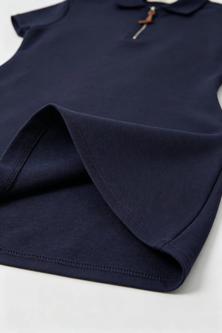 An image of a   23674 Court Zip Polo Mini Dress by  Mirra Masa