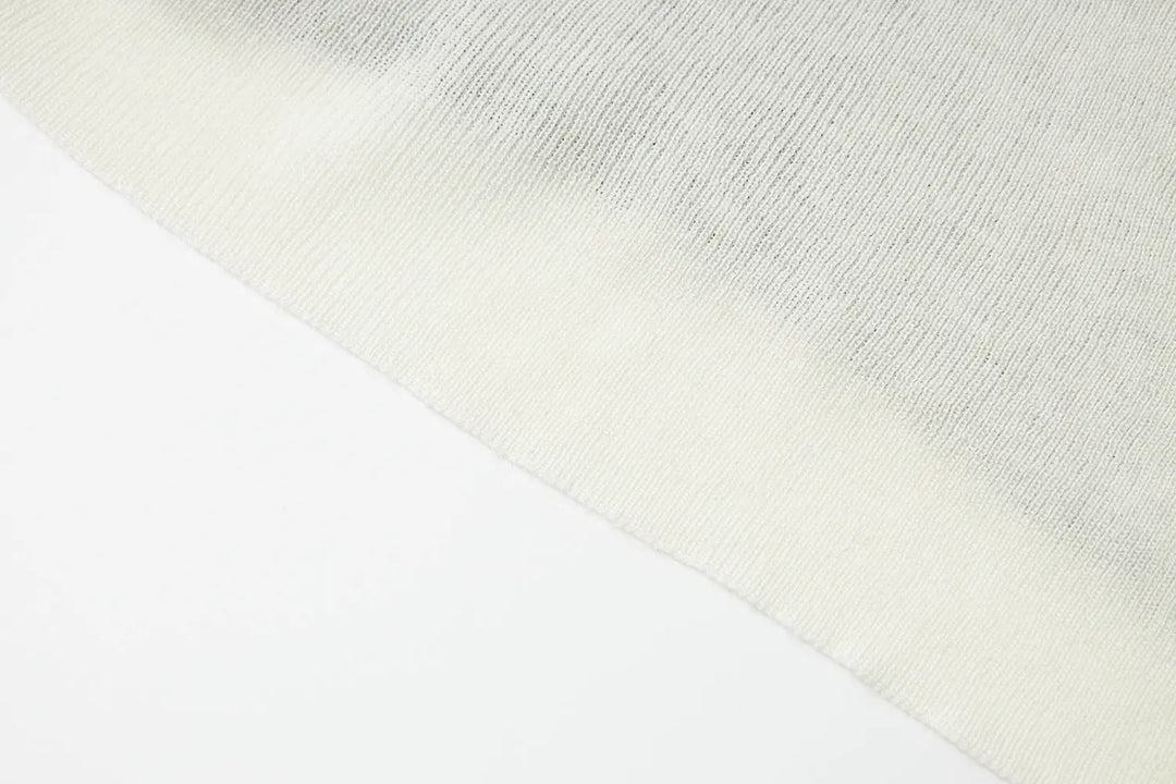 An image of a   31031 Layered Knit Top by  Mirra Masa