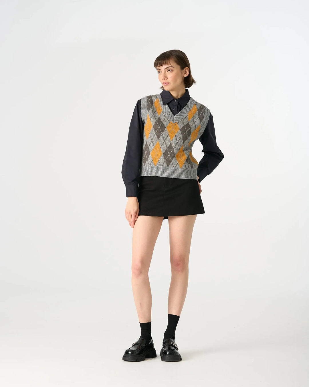 An image of a  Grey / One-Size 31063 Argyle Knit Sweater Vest by  Mirra Masa
