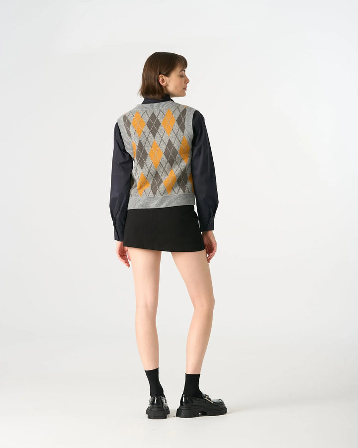 An image of a   31063 Argyle Knit Sweater Vest by  Mirra Masa