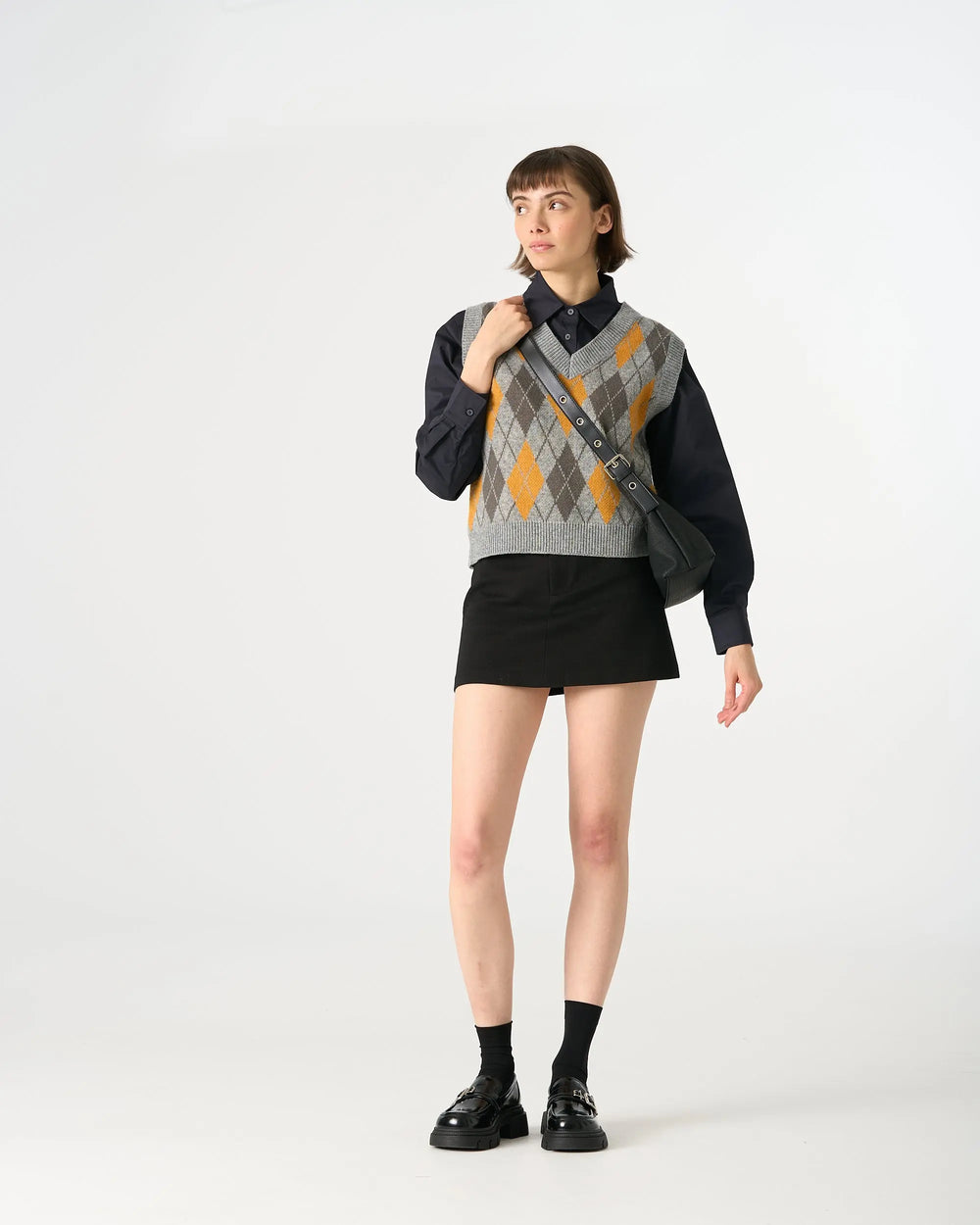 An image of a   31063 Argyle Knit Sweater Vest by  Mirra Masa