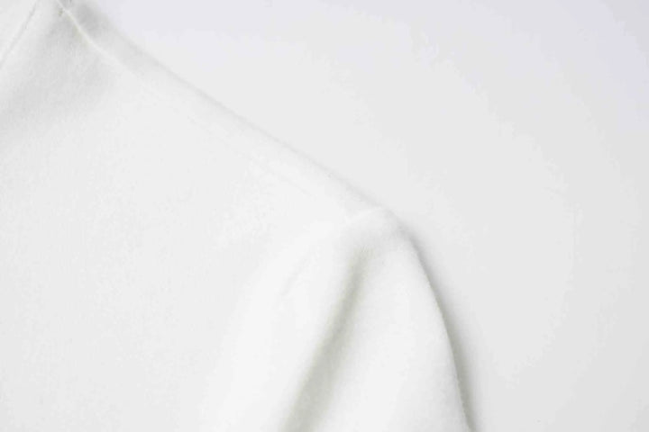 An image of a   31304 Bow Charmed T-Shirt by  Mirra Masa