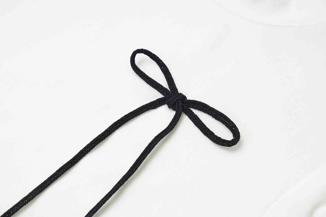 An image of a   31304 Bow Charmed T-Shirt by  Mirra Masa