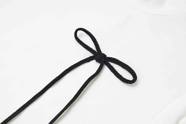 An image of a   31304 Bow Charmed T-Shirt by  Mirra Masa