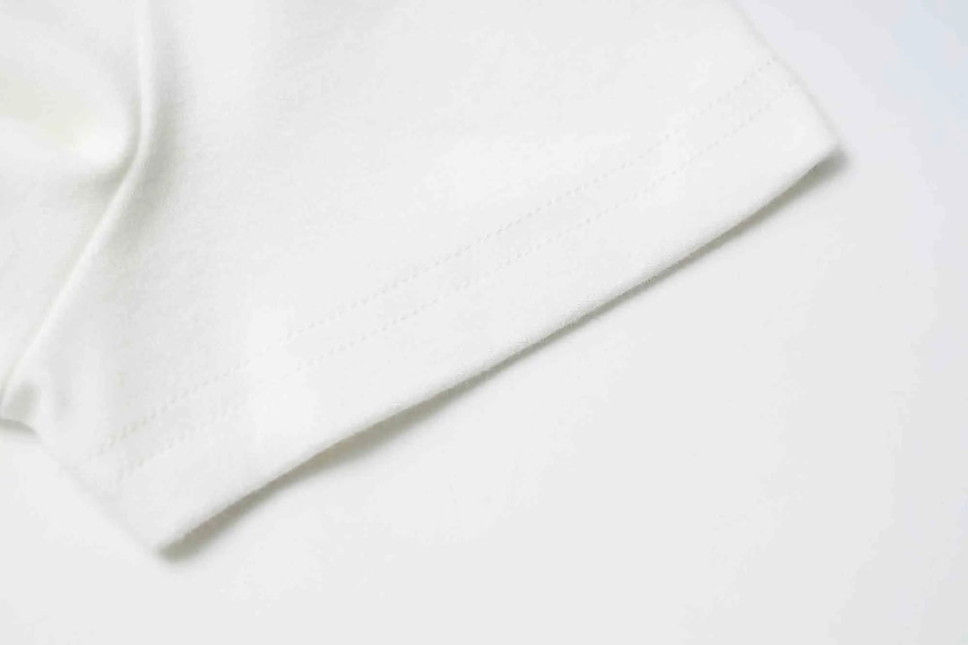 An image of a   31304 Bow Charmed T-Shirt by  Mirra Masa