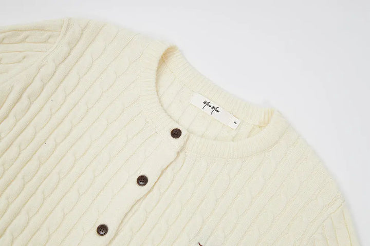 An image of a   31308 Cable Knit Cardigan by  Mirra Masa