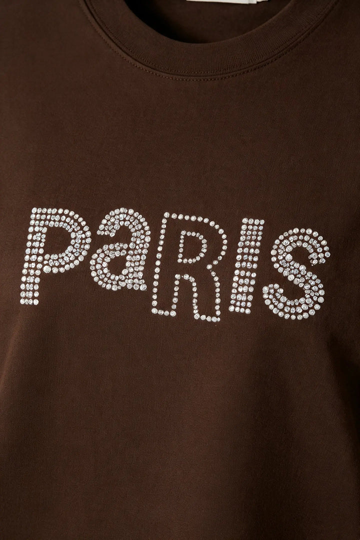 An image of a   31382 Rhinestone Graphic Tee by  Mirra Masa