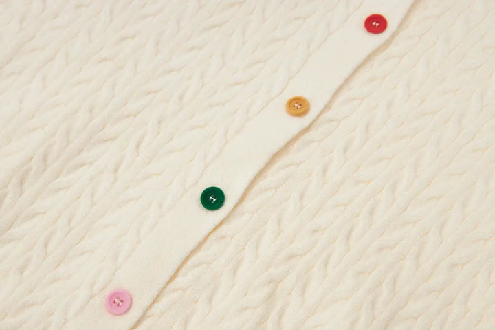 An image of a   31467 Knitwear with Colored Buttons by  Mirra Masa