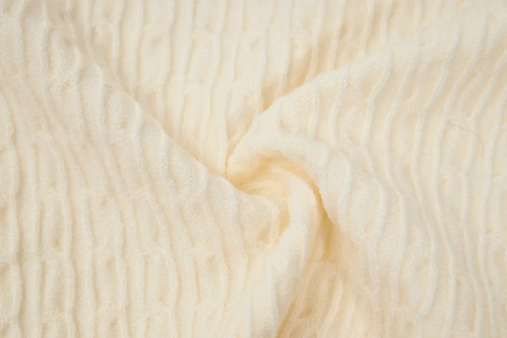 An image of a   31467 Knitwear with Colored Buttons by  Mirra Masa