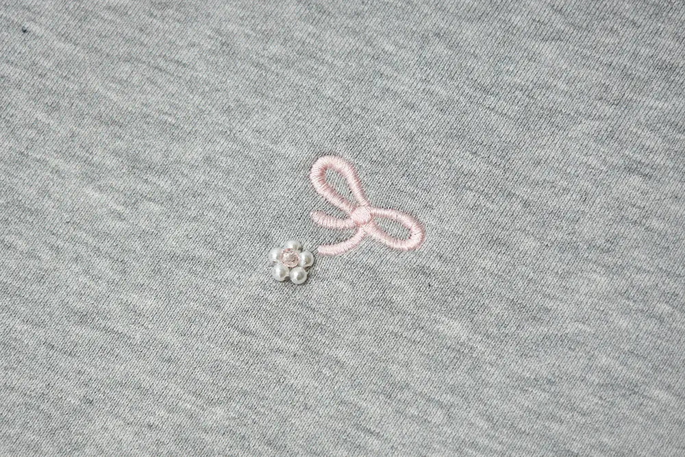 An image of a   31729 Bow Embroidered Crewneck Sweatshirt by  Mirra Masa